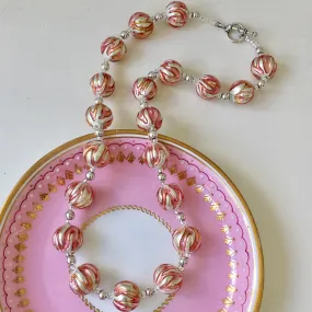 Necklace with pink appliqué over white gold Murano glass sphere beads on silver