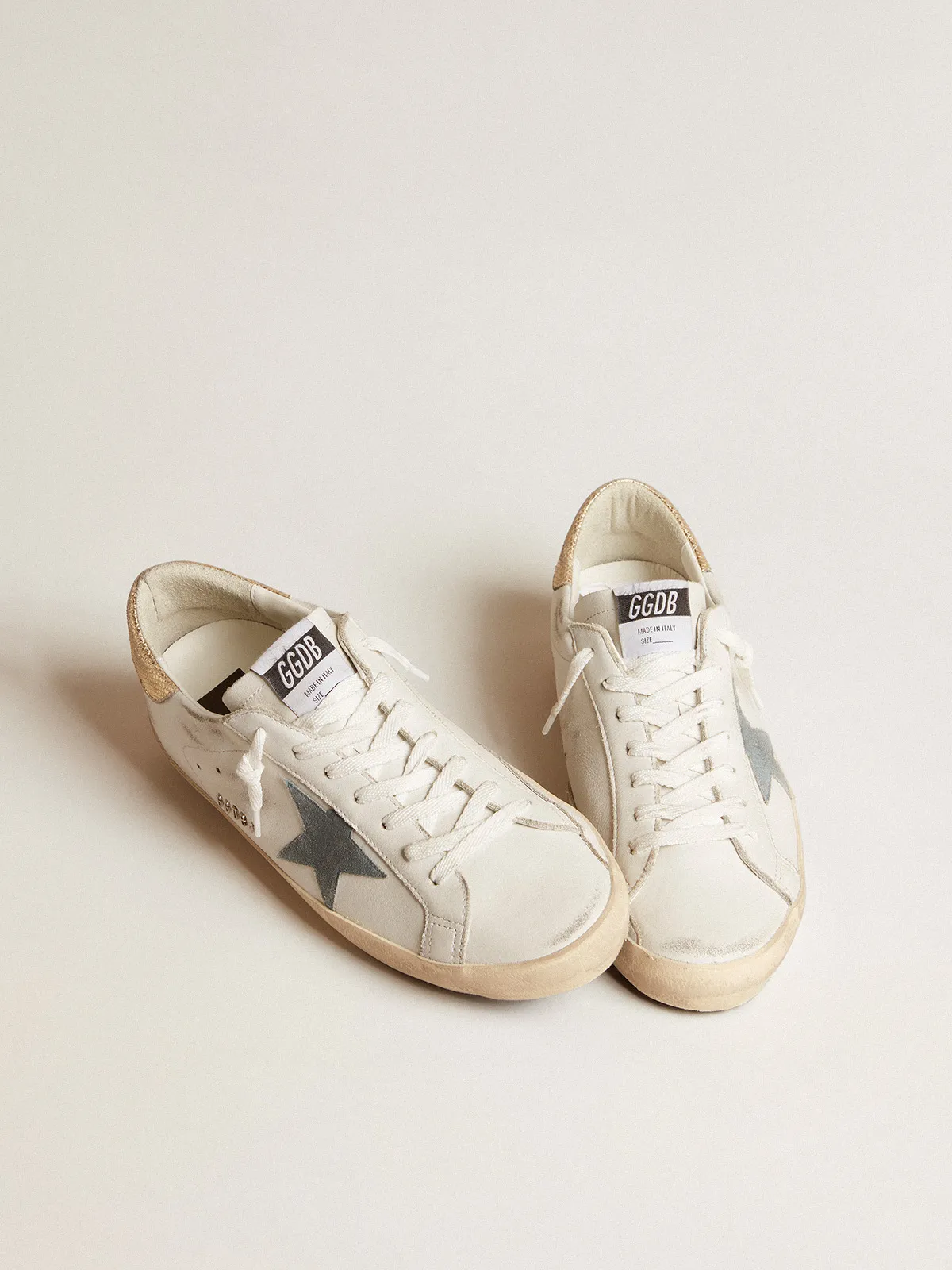 Super-Star with suede star and platinum snake-print leather heel tab