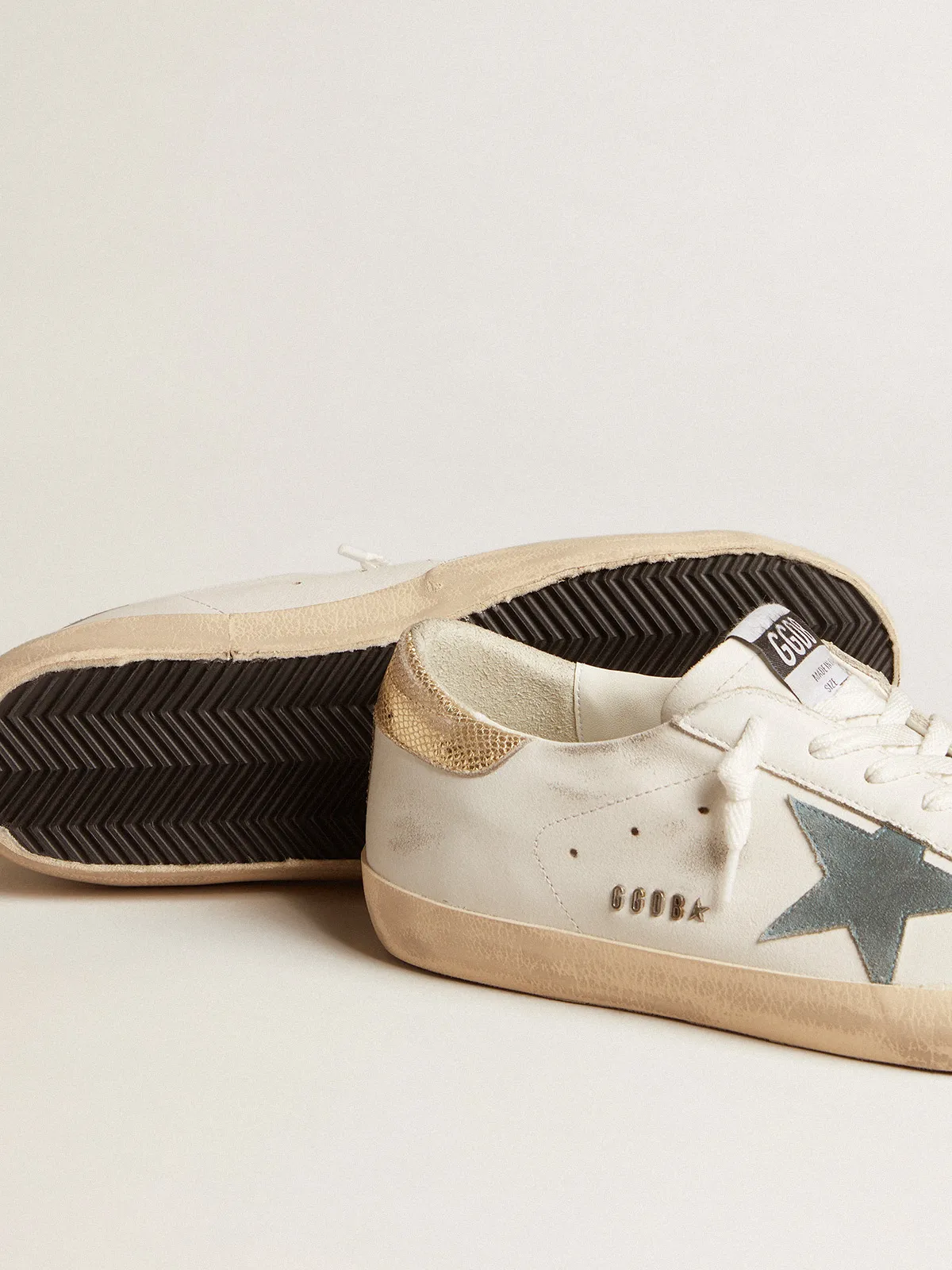 Super-Star with suede star and platinum snake-print leather heel tab